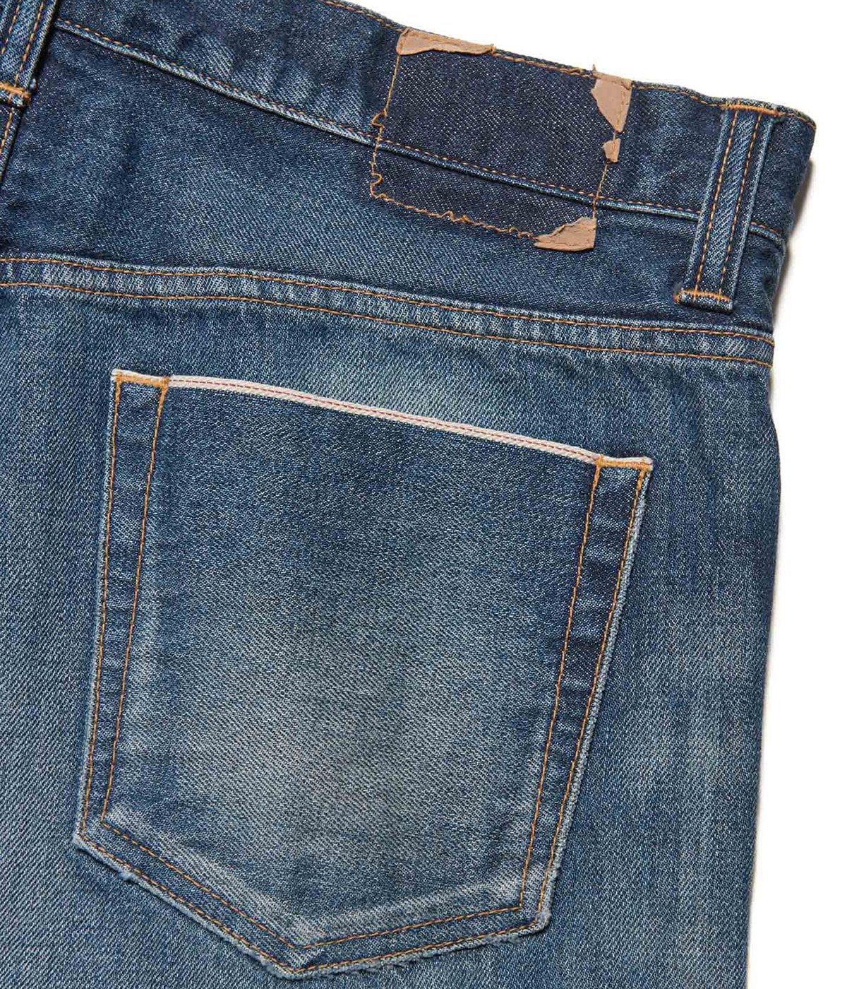 DAMAGED DENIM TAPERED-FIT JEANS | uniform experiment(ユニフォーム