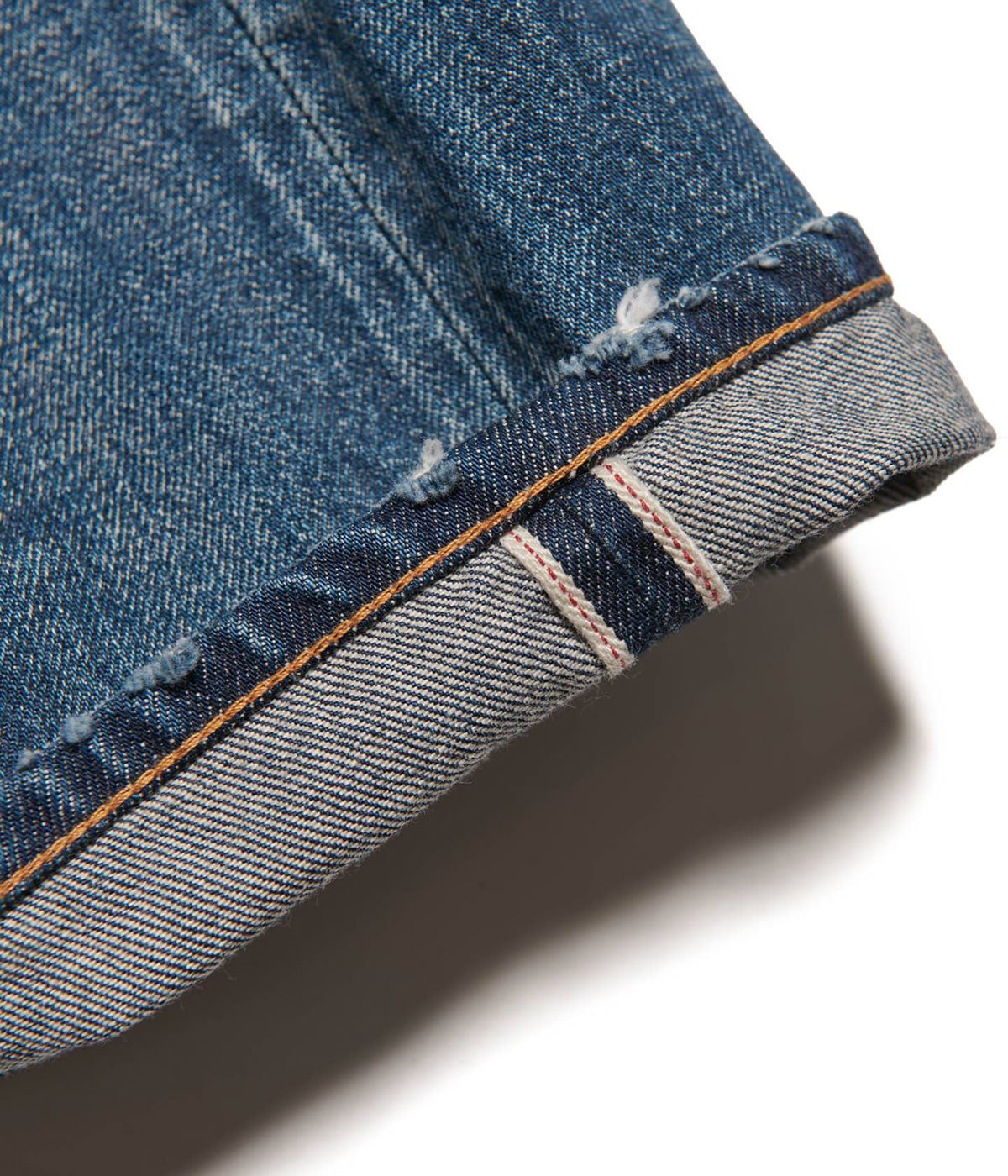 DAMAGED DENIM TAPERED-FIT JEANS | uniform experiment(ユニフォーム